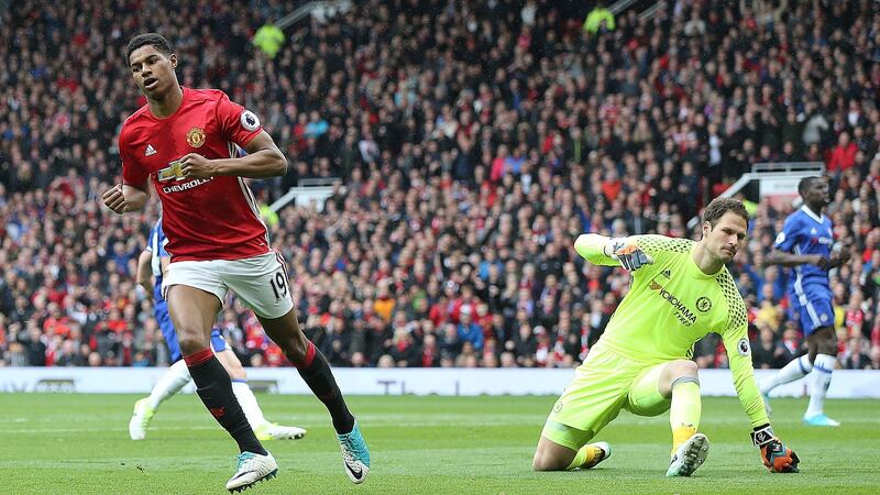 Rashford celebrates after opening the scoring. Photo: Nigel Roddis/EPA