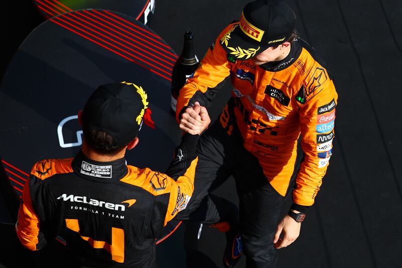 Race winner Oscar Piastri  (right) and McLaren team-mate Lando Norris on the podium after the Hungarian Grand Prix. Photograph: Mark Thompson/Getty Images
