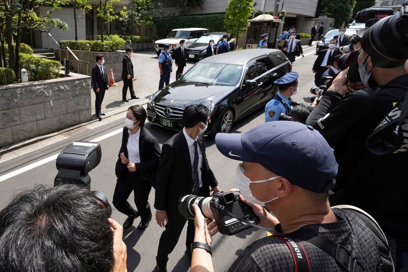 A car believed to be carrying the body of former Japanese prime minister Shinzo Abe arrives at his home in Tokyo. Photograph: Eugene Hoshiko/AP