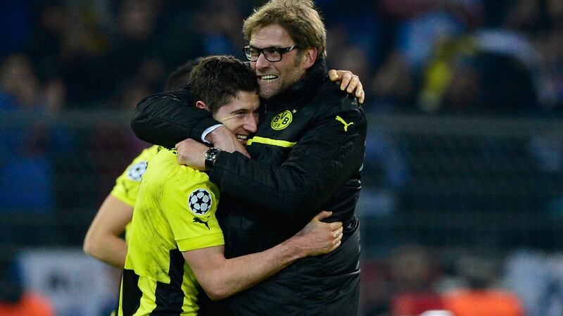 Borussia Dortmund manager Jürgen Klopp hugs Robert Lewandowski after a Champions League quarter-final second leg match against Malaga in 2013. Photograph:  John MacDougall/AFP via Getty Images
