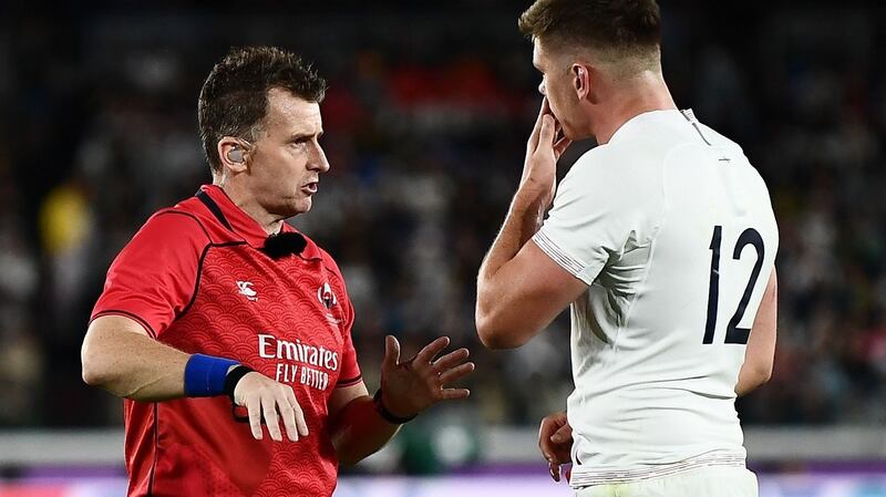 Owen Farrell speaks to Welsh referee Nigel Owens. Photograph: Charly Triballeau/AFP/Getty