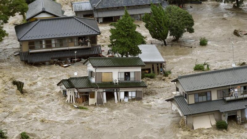 Residents wait for rescue helicopters afterthe Kinugawa river flooded, caused by typhoon Etau. Photograph: Reuters