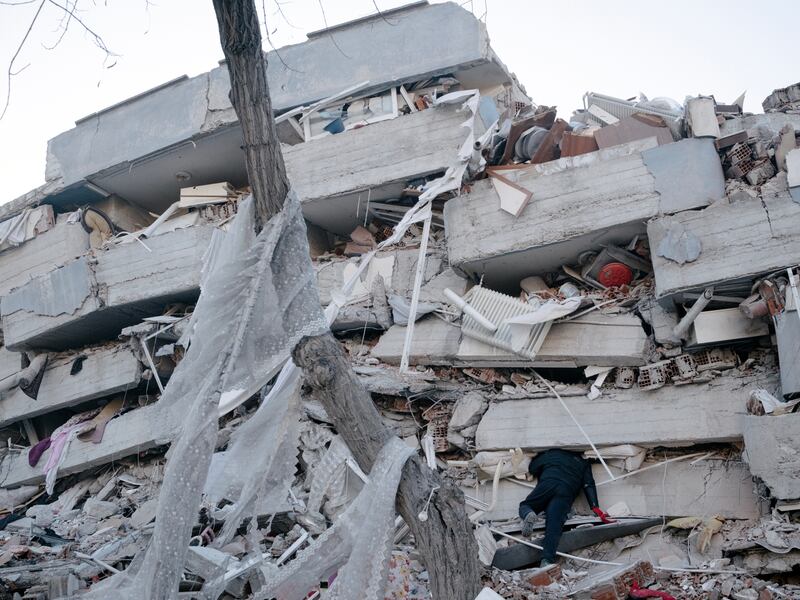 A man calls out his brother’s name while searching the rubble of an apartment building in Kahramanmaras, Turkey, on Tuesday, a day after a  devastating earthquake killed more than 16,000 people in Turkey and Syria. Photograph: Emin Ozmen/New York Times