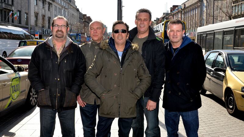 Joe Jewell, Alan Downey, Christy Dignam, Rodney O’Brien and Billy McGuinness of Aslan in O’Connell Street, Dublin in March 2014 after announcing a return to playing live. Photograph: David Sleator/The Irish Times