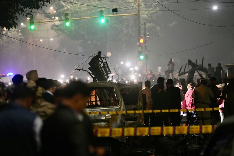 Officials inspected damaged vehicles after a car explosion near the historic Red Fort. Photograph: Manish Swarup/ AP
