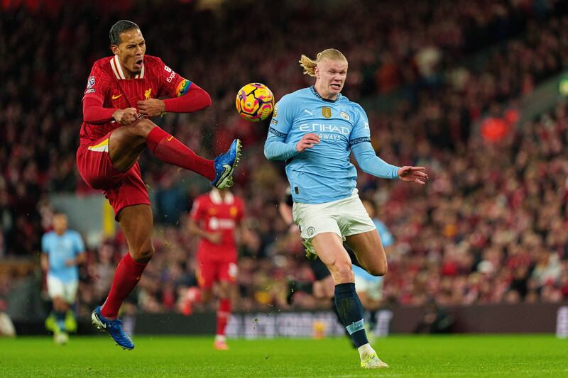 Liverpool's Virgil van Dijk is in action with Manchester City's Erling Haaland. Photograph: MI News/NurPhoto via Getty