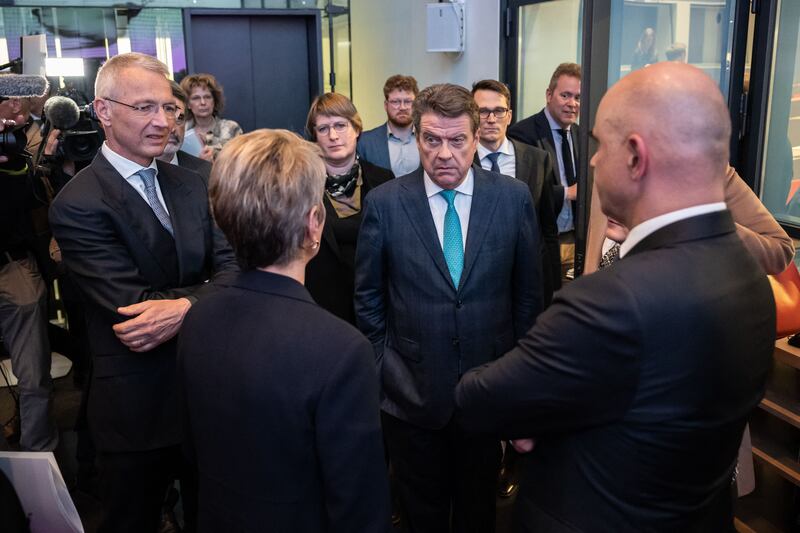 Credit Suisse chairman Axel Lehmann (L) and UBS Chairman Colm Kelleher (2nd R) speak with Swiss Finance Minister Karin Keller-Sutter (2nd L) and Swiss President Alain Berset (R). Photograph: Fabrice Coffrini/AFP via Getty Images