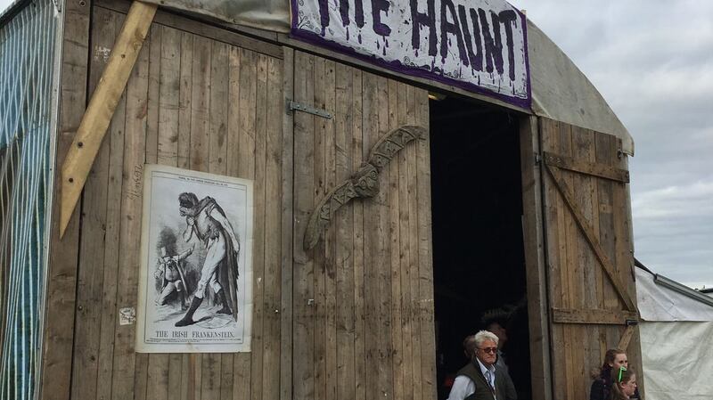 Large doors open into a creepy music hall. Enter. Do it.