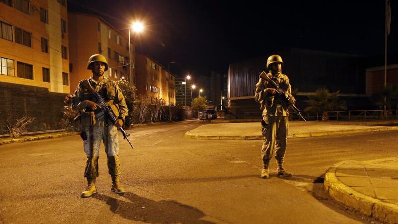 Soldiers patrol to stave off potential looting during an evacuation towards higher zones in the city of Iquique, northern Chile, last night. Photograph: Felipe Trueba/EPA