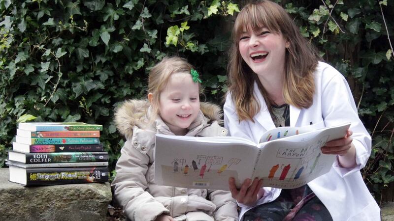 The book doctor will see you now:Three-year-old Nahla Burke and Children’s Books Ireland Book Doctor Kim Harte.