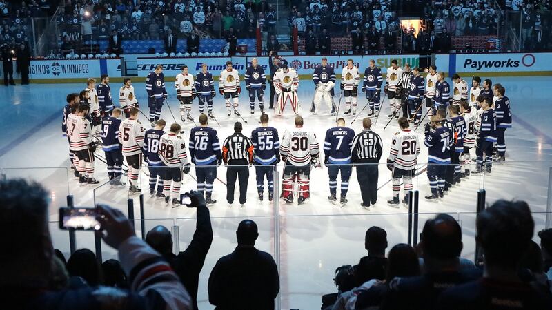 Players from the Winnipeg Jets and Chicago Blackhawks honour those killed and injured in the Humboldt Broncos bus crash tragedy before their NHL game on Saturday. Photograph:  Jason Halstead/Getty Images.