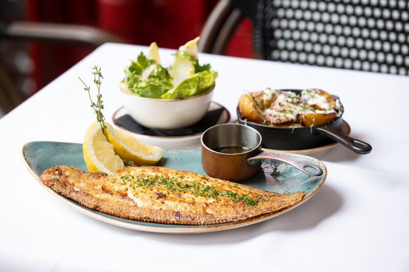 A dish from La Maison: sole meunière with capers, white butter, lemon and sides of baby gem salad, fine herbs, French dressing and roasted baby potatoes, rocket, garlic mayo and aged parmesan. Photograph: Tom Honan