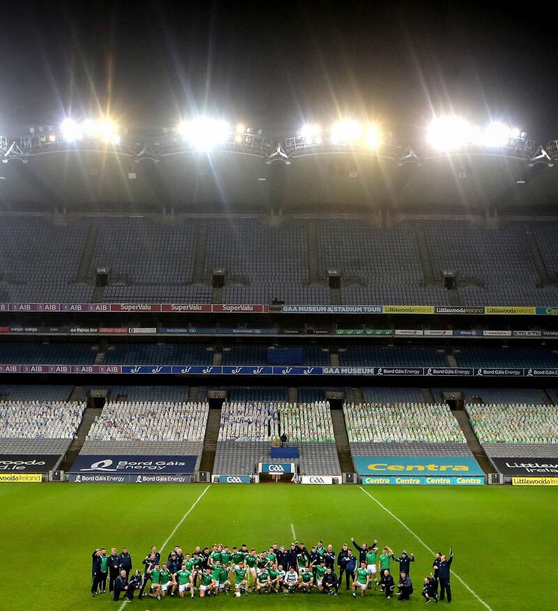 The Limerick management and players celebrate with the Cusack Stand towering behind them. Photo: Ryan Byrne