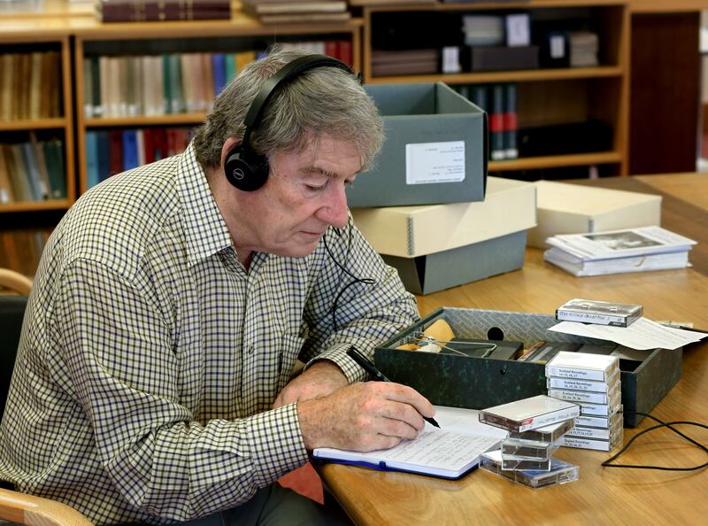 Ó Cróinín, former professor of history at the University of Galway, takes notes on the collection. Photograph: Joe O'Shaughnessy