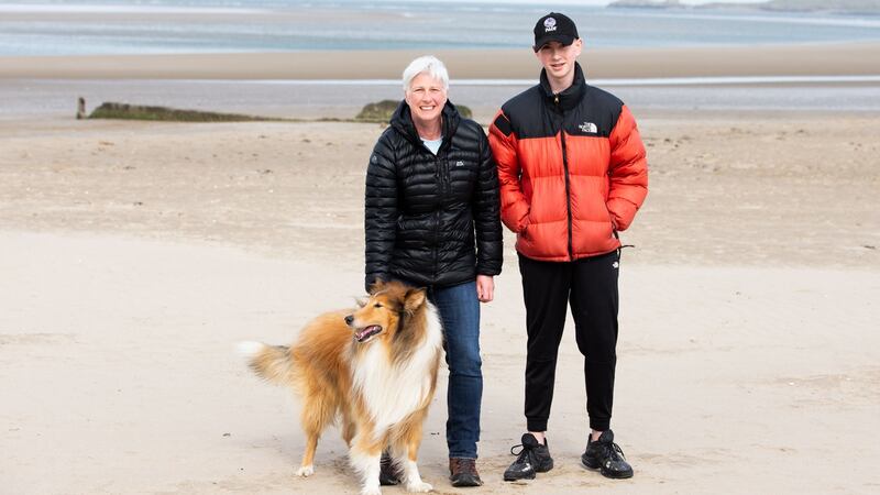 Niamh Kenny, her son Liam Kenny and their dog Alfie on Burrow Beach in Sutton, Dublin. Photograph: Tom Honan/The Irish Times