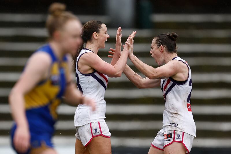 Amy Mulholland and Megan Kauffman of the Dockers celebrate a goal during the AFLW Practice Match between the Fremantle Dockers and the West Coast Eagles. Photograph: Paul Kane/Getty Images