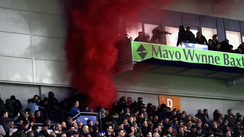 A flare is set off in the Palace section. Photo: Bryn Lennon/Getty Images