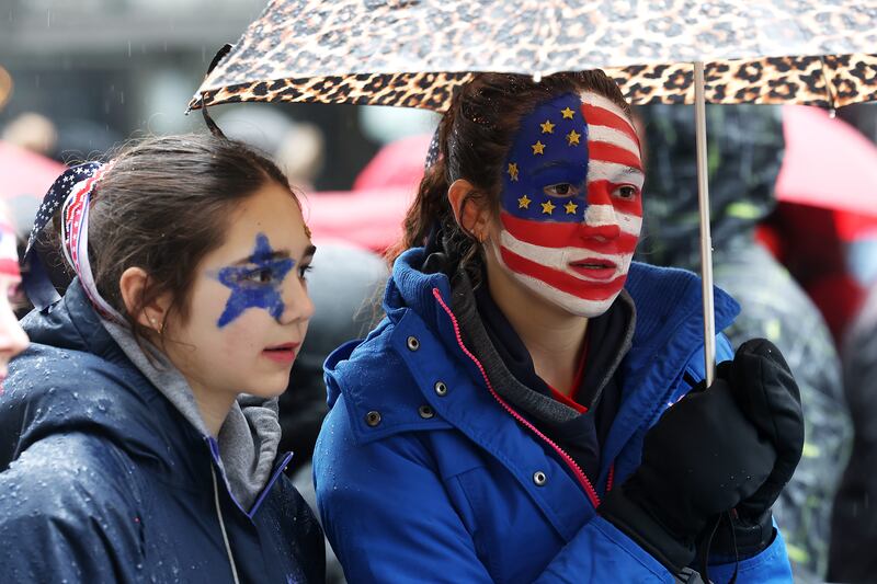 Supporters wait in line at Capital One Arena for Donald Trump's victory rally in Washington, DC on Sunday. Photograph: Joe Raedle/Getty Images