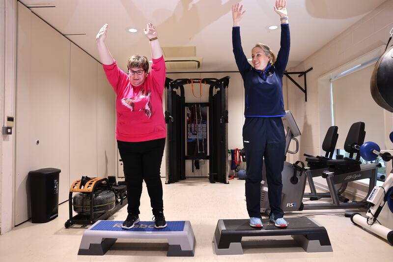 Lynne Conroy being shown some exercises by Sarah Hewitt as part of  the Active Healthy Me programme. Photograph: Dara Mac Dónaill 
