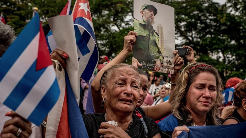 Mourners weeping as a caravan carrying Fidel Castro’s ashes passes through Santa Clara, Cuba, in December 2016. Photograph:  Tomas Munita/The New York Times