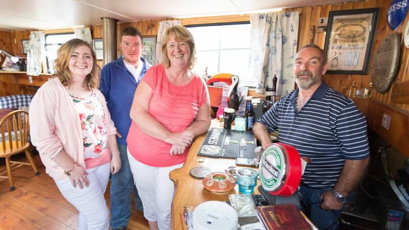 Aoife and Daniel Burke with their parents Geraldine and Gerry on their boat in Terryglass, Co Tipperary. Photograph: Eamon Ward