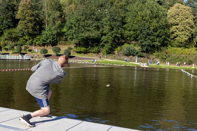 A stone skimming championship in Belgium in September 2023. Photograph: Julien Warnand/EPA