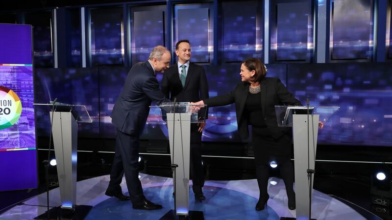 Micheál Martin shakes hands with Mary Lou McDonald as Leo Varadkar looks on at the final TV leaders’ debate, February 4th 2020. Photograph: Niall Carson/PA Wire