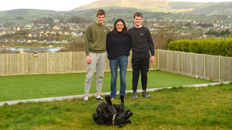 Olive Foley with her sons Tony and Dan and Trapper the dog at their home in Killaloe, Co Clare. Photograph: Diarmuid Greene