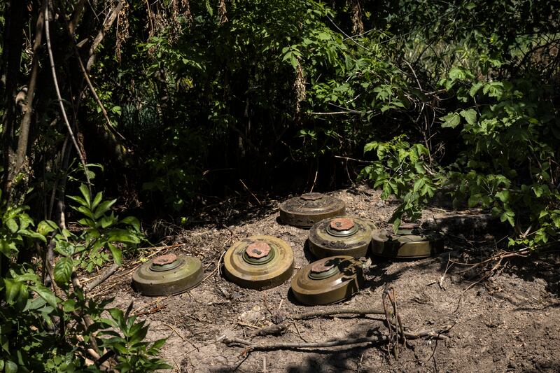 Six mines in Novodarivka. To gain ground, Ukrainian forces have to make their way through a variety and density of Russian land mines they never imagined. Photograph: David Guttenfelder/The New York Times
                      
