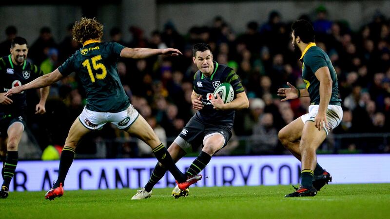 Man of the match Johnny Sexton  avoids Andries Coetzee during Ireland v South Africa at Aviva Stadium. Photograph: Cyril Byrne