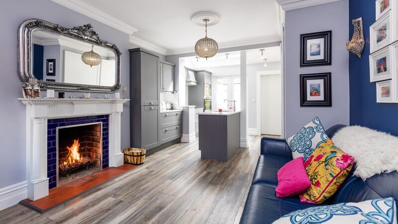 The use  of contrasting wall paints gives a sense of mild opulence to the opened-up ground floor