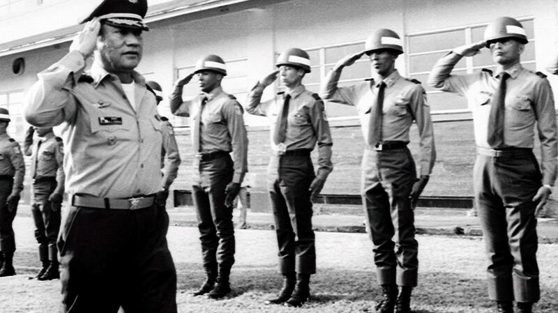 Manuel Noriega salutes troops at an undisclosed location in Panama in 1985. Photograph: EPA