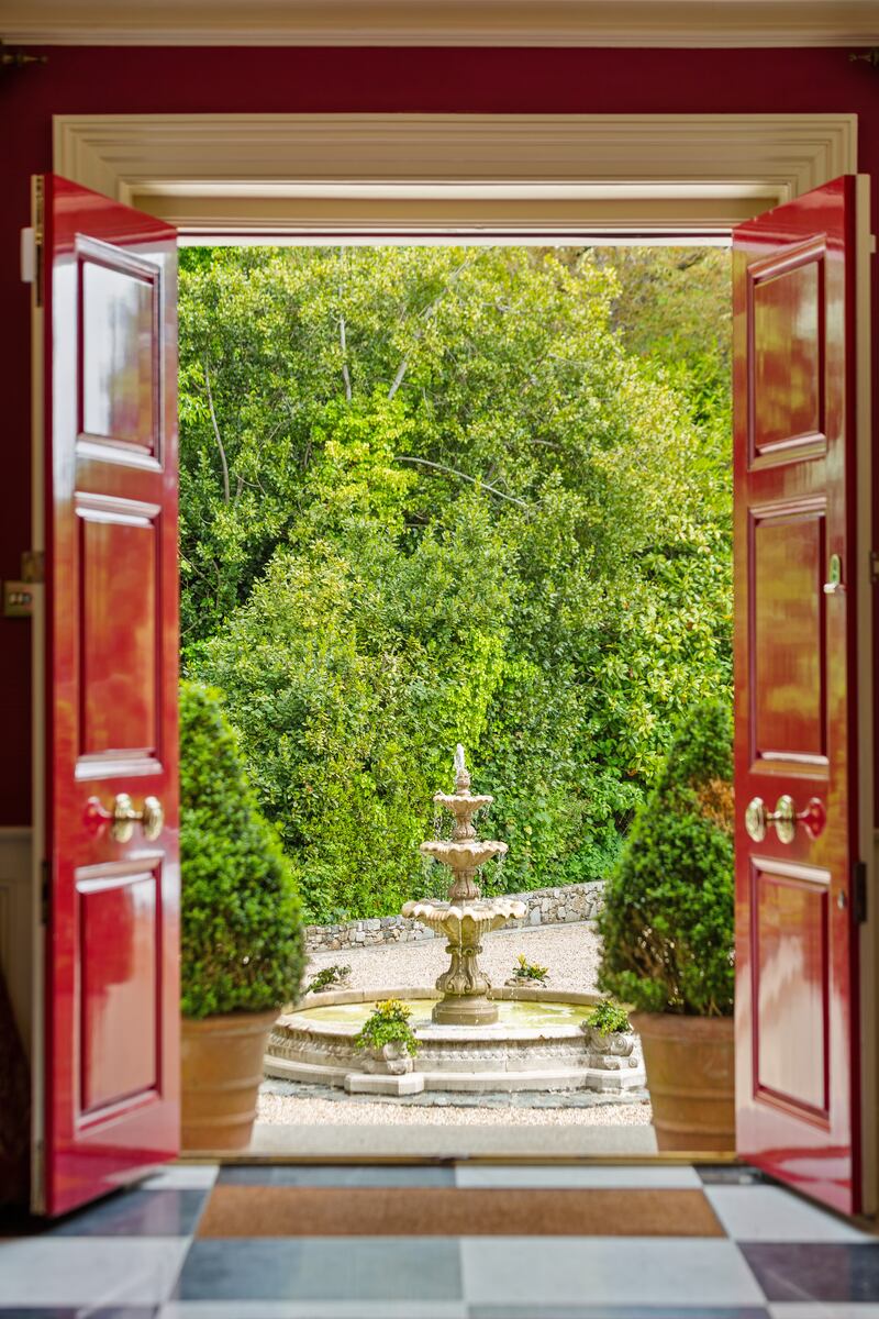 Front entrance is centred by a fountain